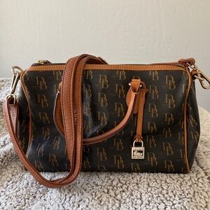 Dooney Bourke monogram handbag 12” long  9” depth 71/2 width with dust bag